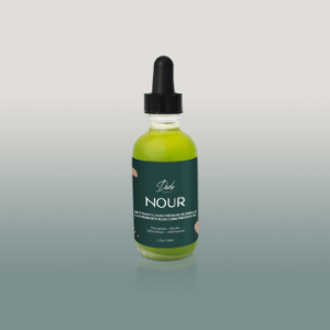 Huile nettoyante nourrissante en bouteille givrée NOUR